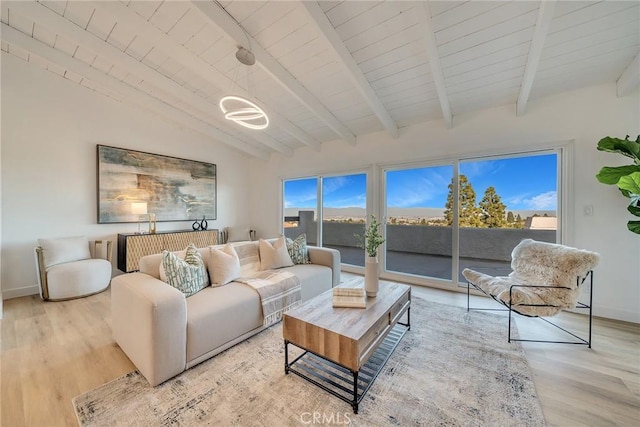 living room with wooden ceiling, light wood-type flooring, and vaulted ceiling with beams