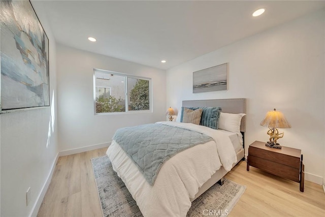 bedroom with light hardwood / wood-style flooring