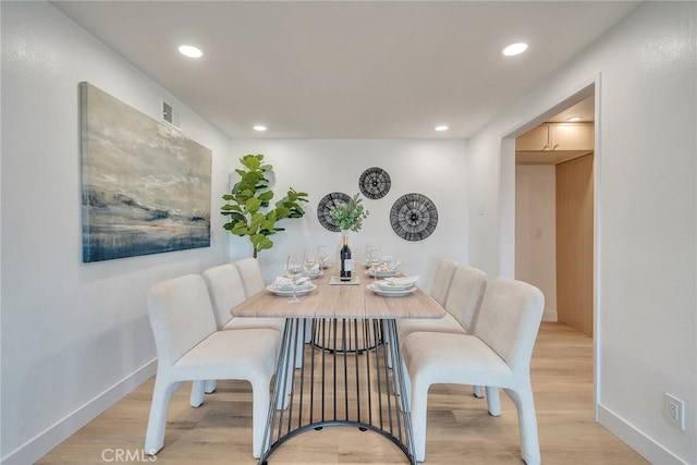 dining room with light wood-type flooring