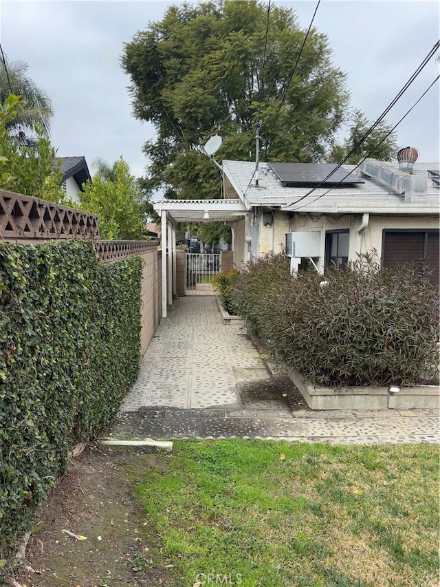 view of front of property with solar panels