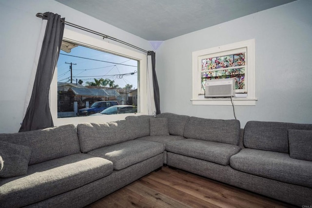 living room featuring cooling unit and dark hardwood / wood-style flooring