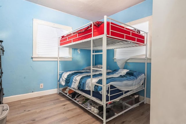 bedroom featuring wood-type flooring