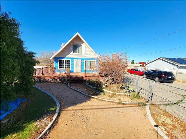 view of front of home featuring a wooden deck