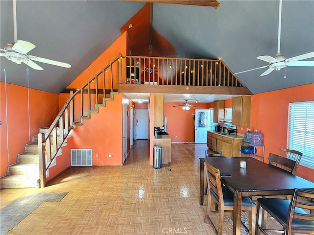 dining room featuring ceiling fan and light parquet flooring