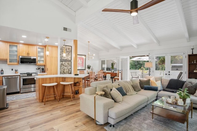 living room with french doors, high vaulted ceiling, light hardwood / wood-style flooring, beamed ceiling, and ceiling fan