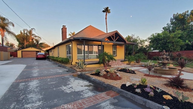 view of front of house featuring an outbuilding and a garage