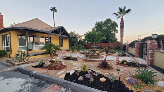 view of yard at dusk