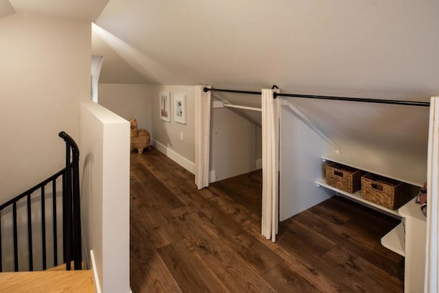 interior space featuring wood-type flooring and lofted ceiling