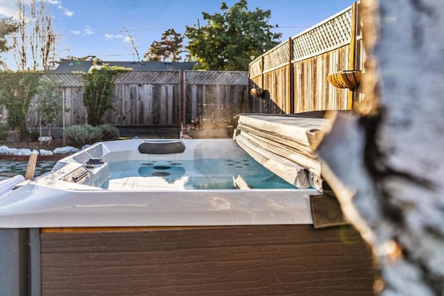 exterior space with a hot tub