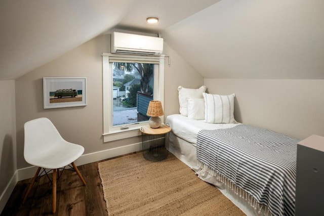 bedroom with vaulted ceiling, a wall mounted AC, and dark hardwood / wood-style flooring