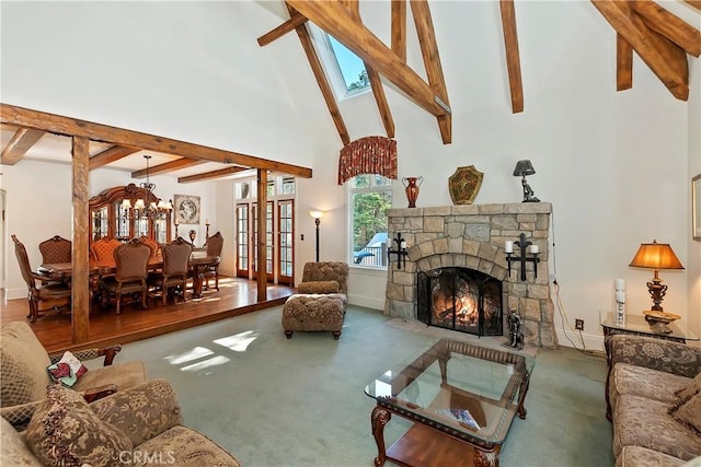 living room featuring a stone fireplace, carpet floors, beamed ceiling, and a high ceiling