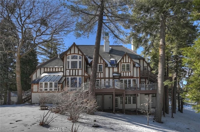 29223 Pigeon Hawk Ln, Lake Arrowhead, CA 92352 - rear view of property with stairs, a chimney, a wooden deck, and stucco siding
