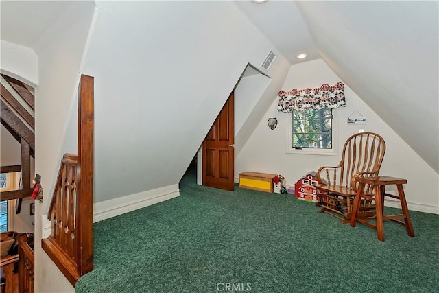 interior space with lofted ceiling and carpet flooring