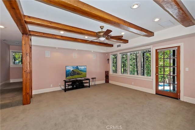 carpeted living room with beamed ceiling and ceiling fan