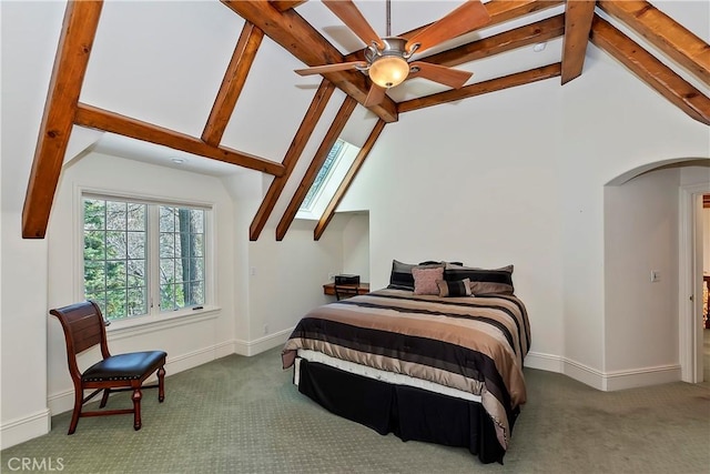 bedroom with lofted ceiling with beams and carpet flooring