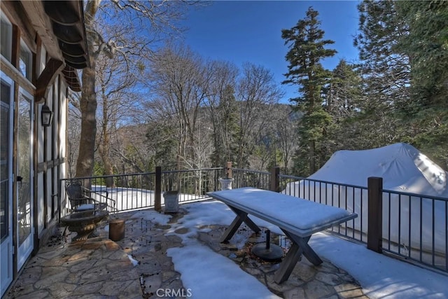 view of snow covered patio