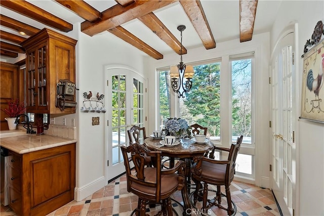 29223 Pigeon Hawk Ln, Lake Arrowhead, CA 92352 - dining area featuring beamed ceiling and a chandelier
