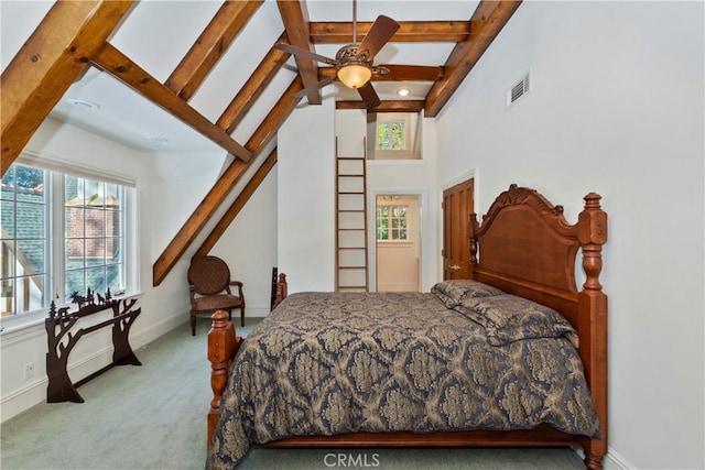 carpeted bedroom featuring vaulted ceiling with beams