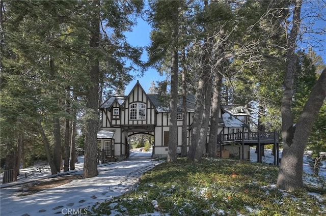 tudor house featuring a deck