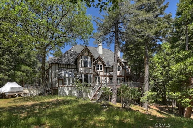 29223 Pigeon Hawk Ln, Lake Arrowhead, CA 92352 - rear view of house featuring stairs, a chimney, a wooden deck, and a shingled roof