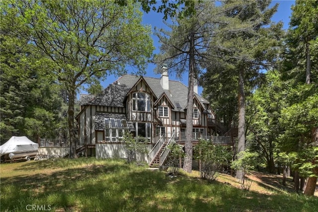 29223 Pigeon Hawk Ln, Lake Arrowhead, CA 92352 - back of house featuring stairway, a chimney, a wooden deck, and roof with shingles