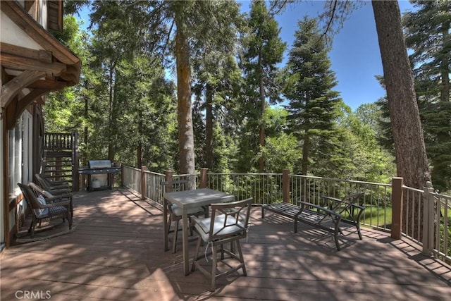 29223 Pigeon Hawk Ln, Lake Arrowhead, CA 92352 - wooden deck with outdoor dining area and area for grilling