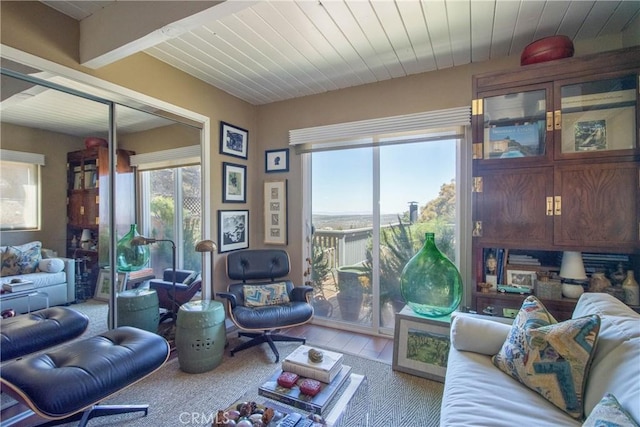 living room featuring wooden ceiling and light hardwood / wood-style floors