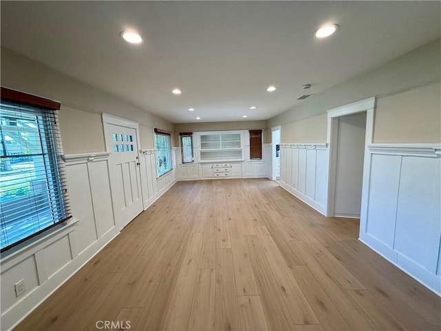 unfurnished living room featuring light hardwood / wood-style flooring