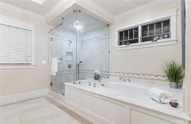 bathroom featuring a shower stall, baseboards, a garden tub, and crown molding