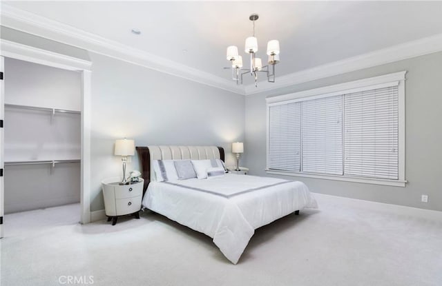 bedroom featuring baseboards, a closet, a chandelier, and crown molding