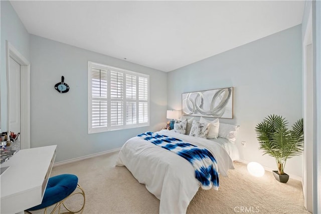 bedroom with light colored carpet