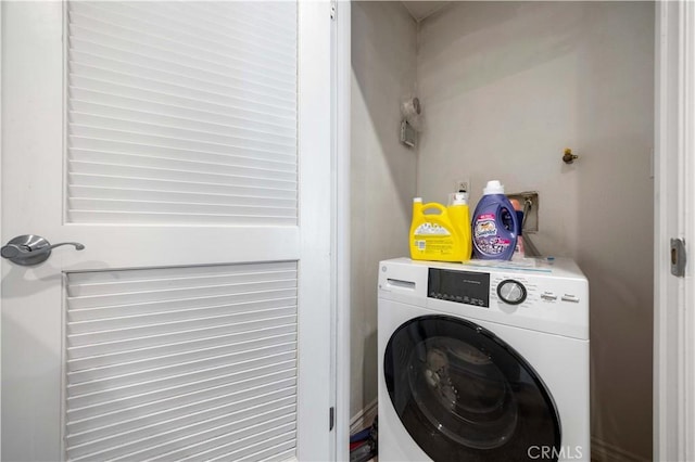 laundry room featuring washer / dryer