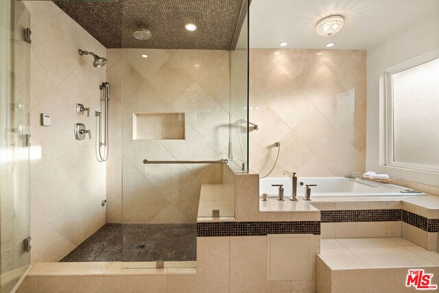 bathroom featuring plus walk in shower