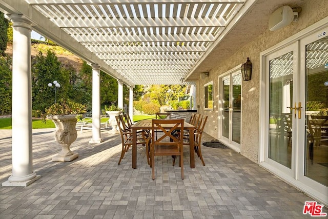 view of patio / terrace featuring french doors and a pergola