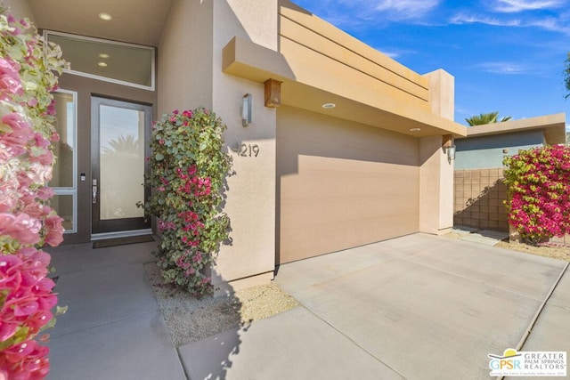 entrance to property featuring a patio