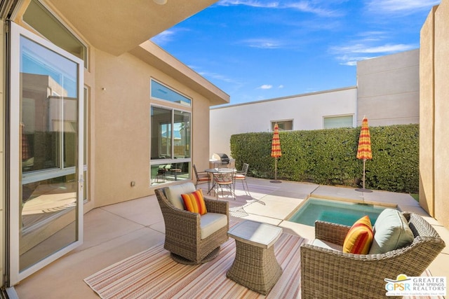 view of swimming pool featuring a patio