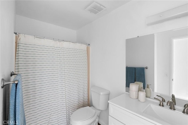 bathroom with vanity, a shower with curtain, and toilet