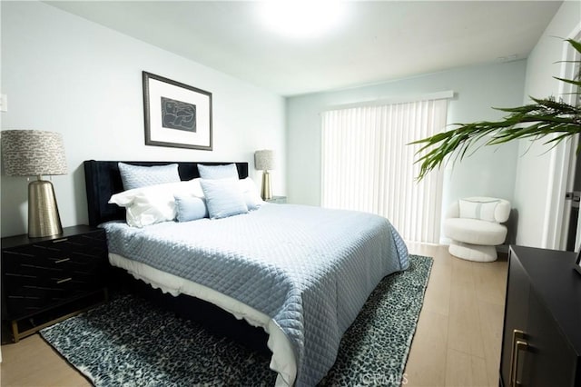 bedroom with hardwood / wood-style floors