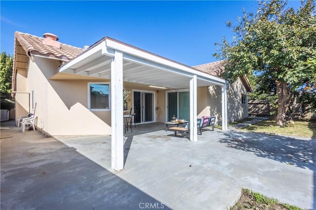 back of house featuring a patio area