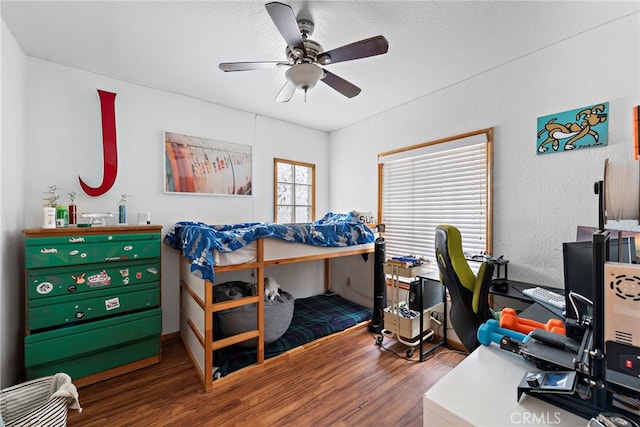 bedroom with ceiling fan and hardwood / wood-style floors