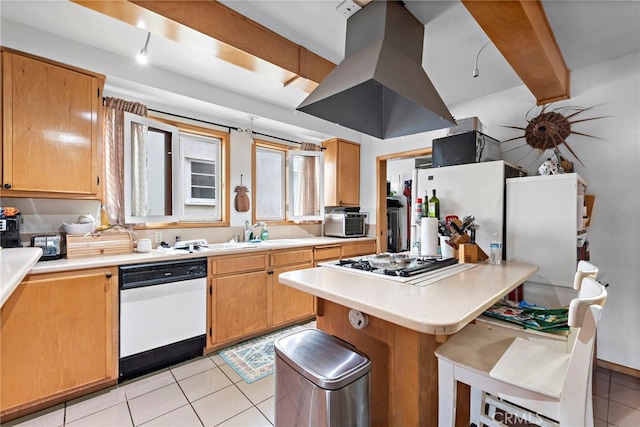 kitchen with a kitchen bar, island range hood, light tile patterned floors, white appliances, and beam ceiling