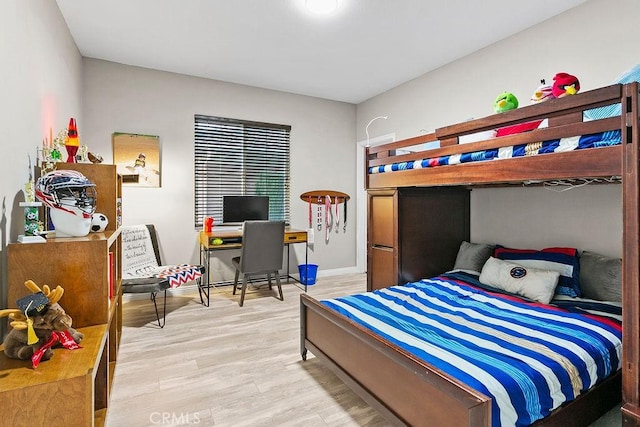 bedroom with light hardwood / wood-style floors