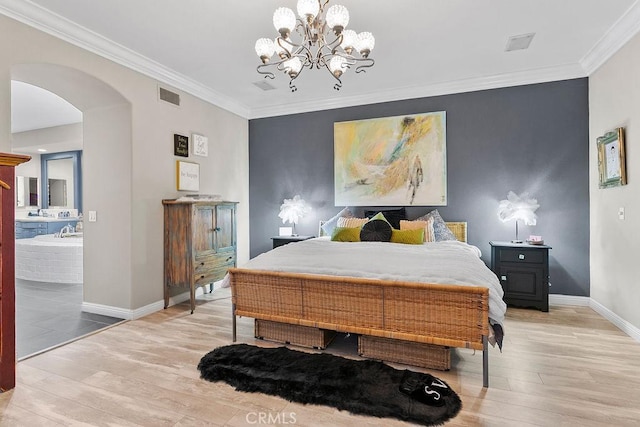 bedroom featuring ornamental molding, light hardwood / wood-style floors, and a chandelier