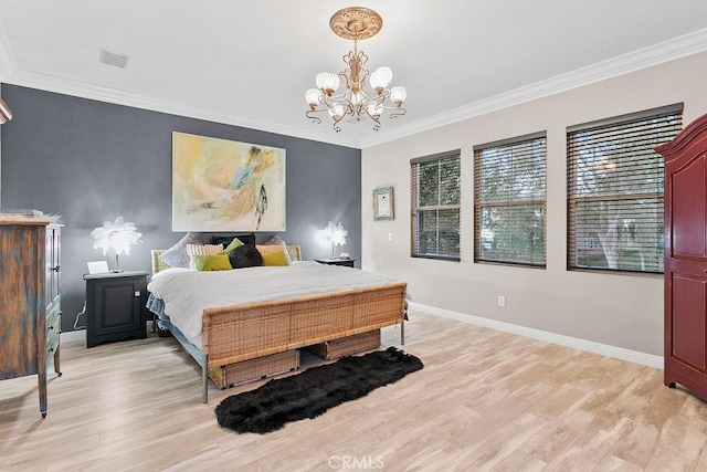 bedroom featuring ornamental molding and light hardwood / wood-style floors