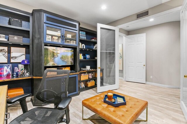 interior space featuring baseboards, visible vents, french doors, light wood-style floors, and recessed lighting