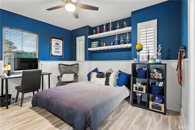 bedroom featuring hardwood / wood-style flooring and ceiling fan