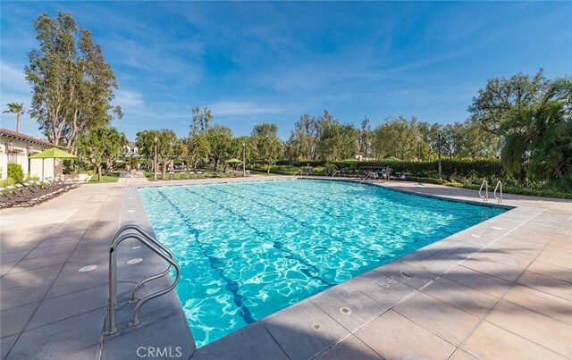 community pool with a patio