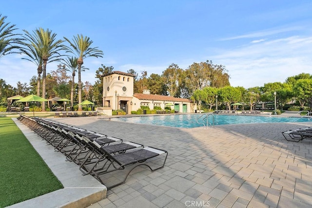 view of swimming pool with a patio