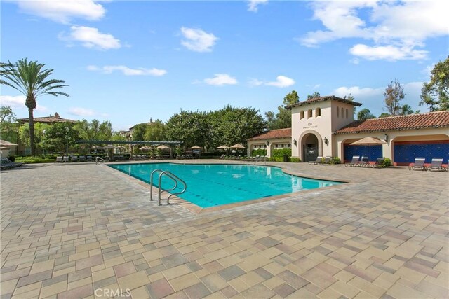 community pool with a patio area