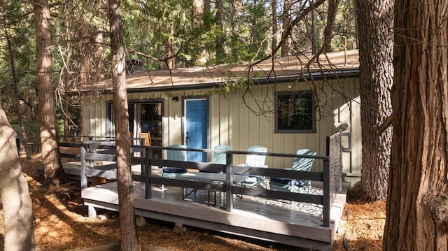 rear view of house with a wooden deck